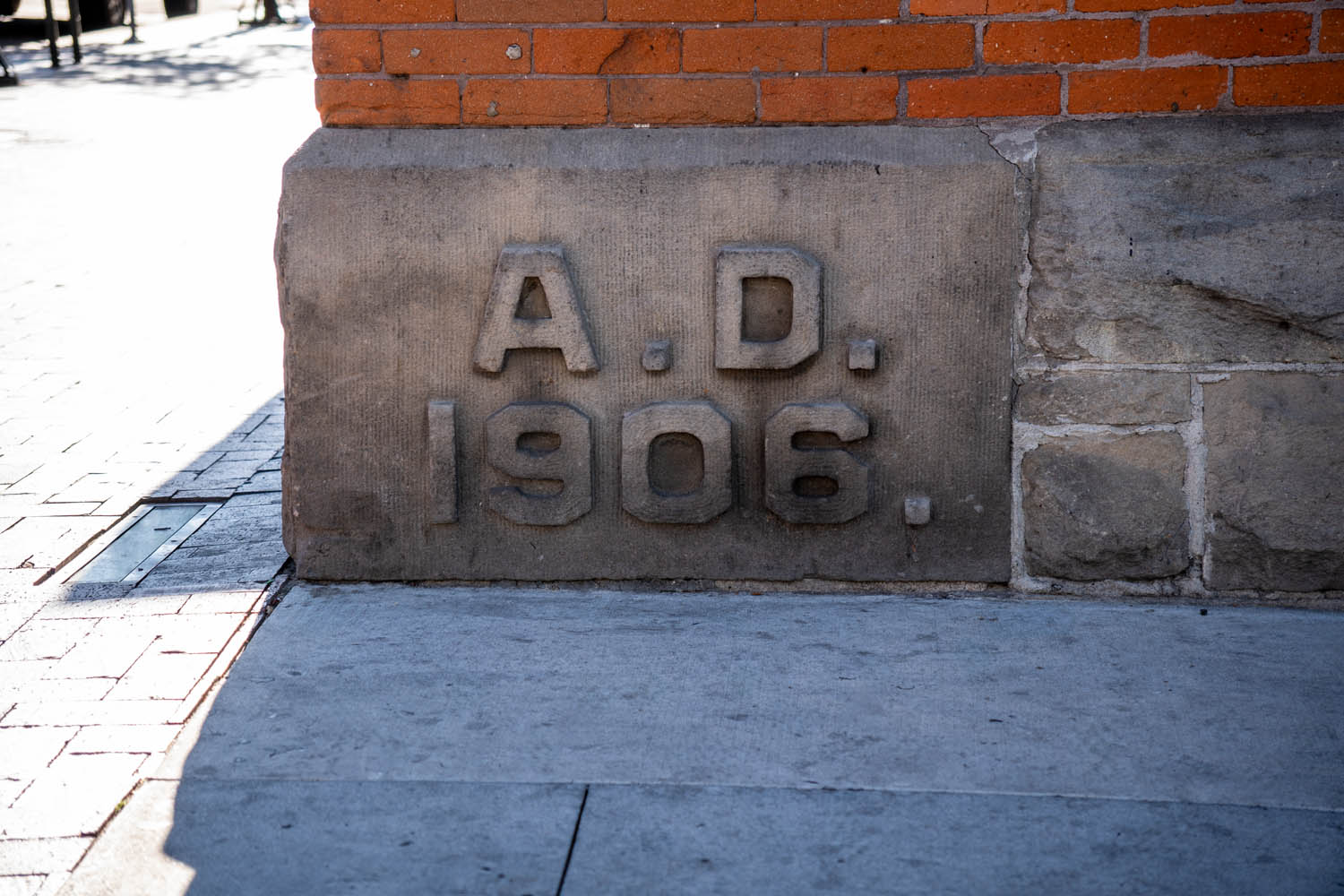 Stone foundation in downtown Boise marked “A.D. 1906,” showing a durable remnant of the city’s early built inheritance.